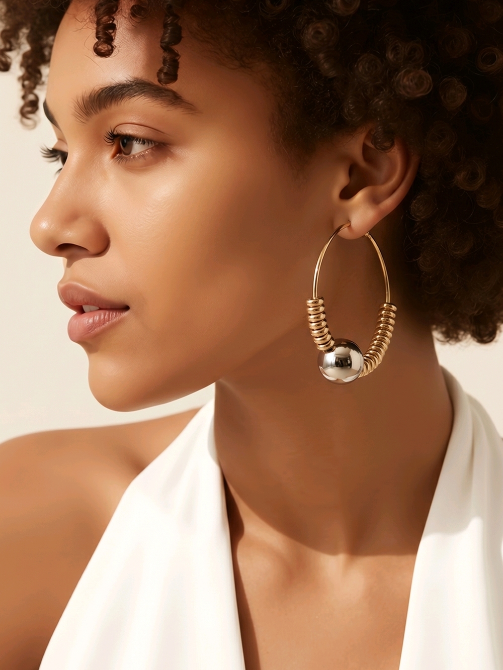 Daisy Fuentes gold plated and silver ball earrings